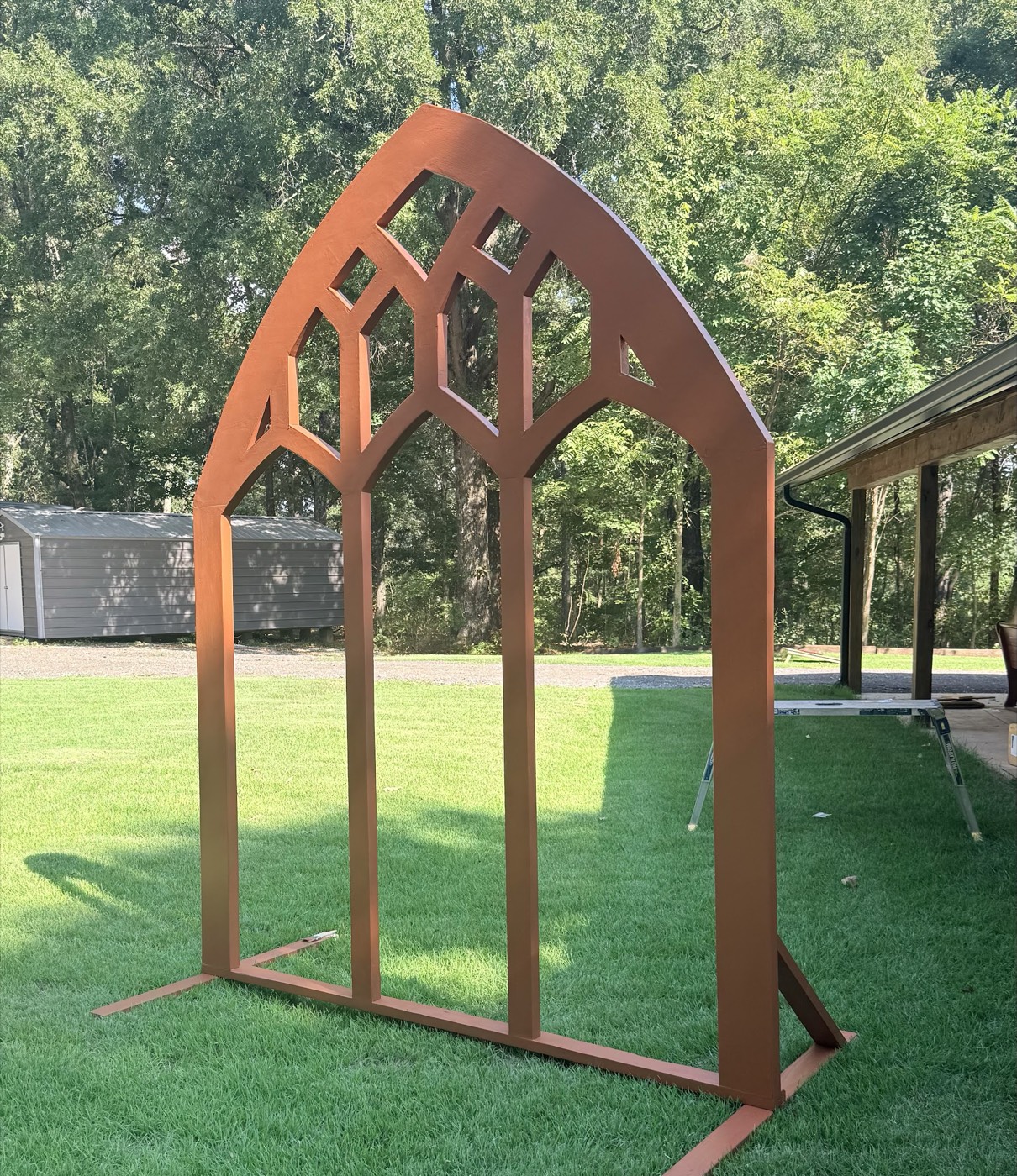 Wooden ceremony arch on the lawn