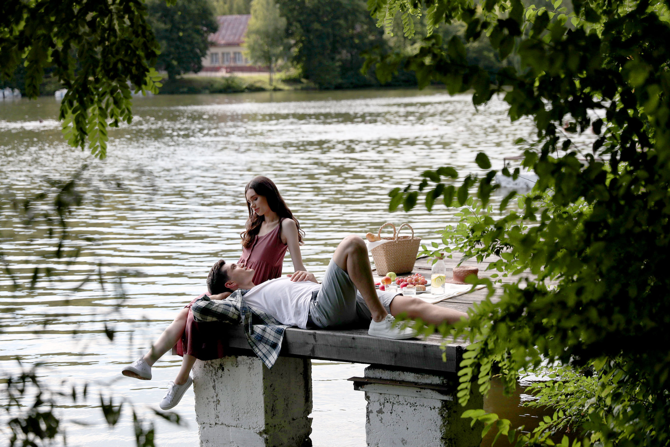 Couple relaxing by the pond