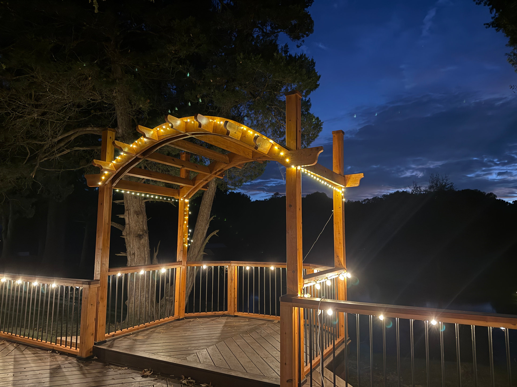 Lit gazebo balcony at dusk