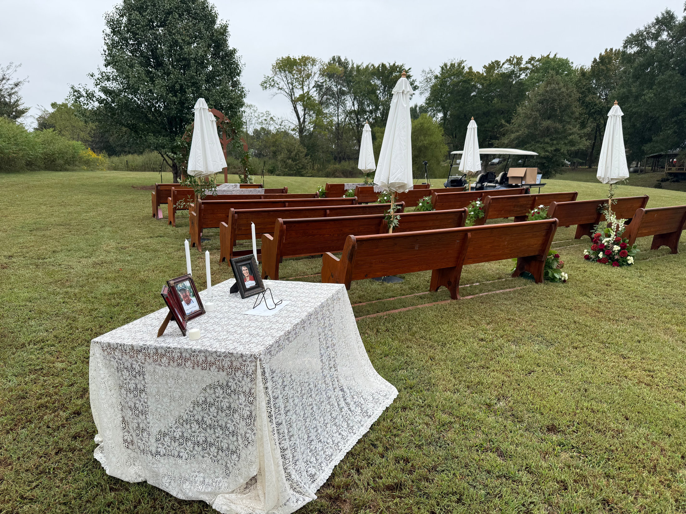 Long outdoor dinner table on the lawn