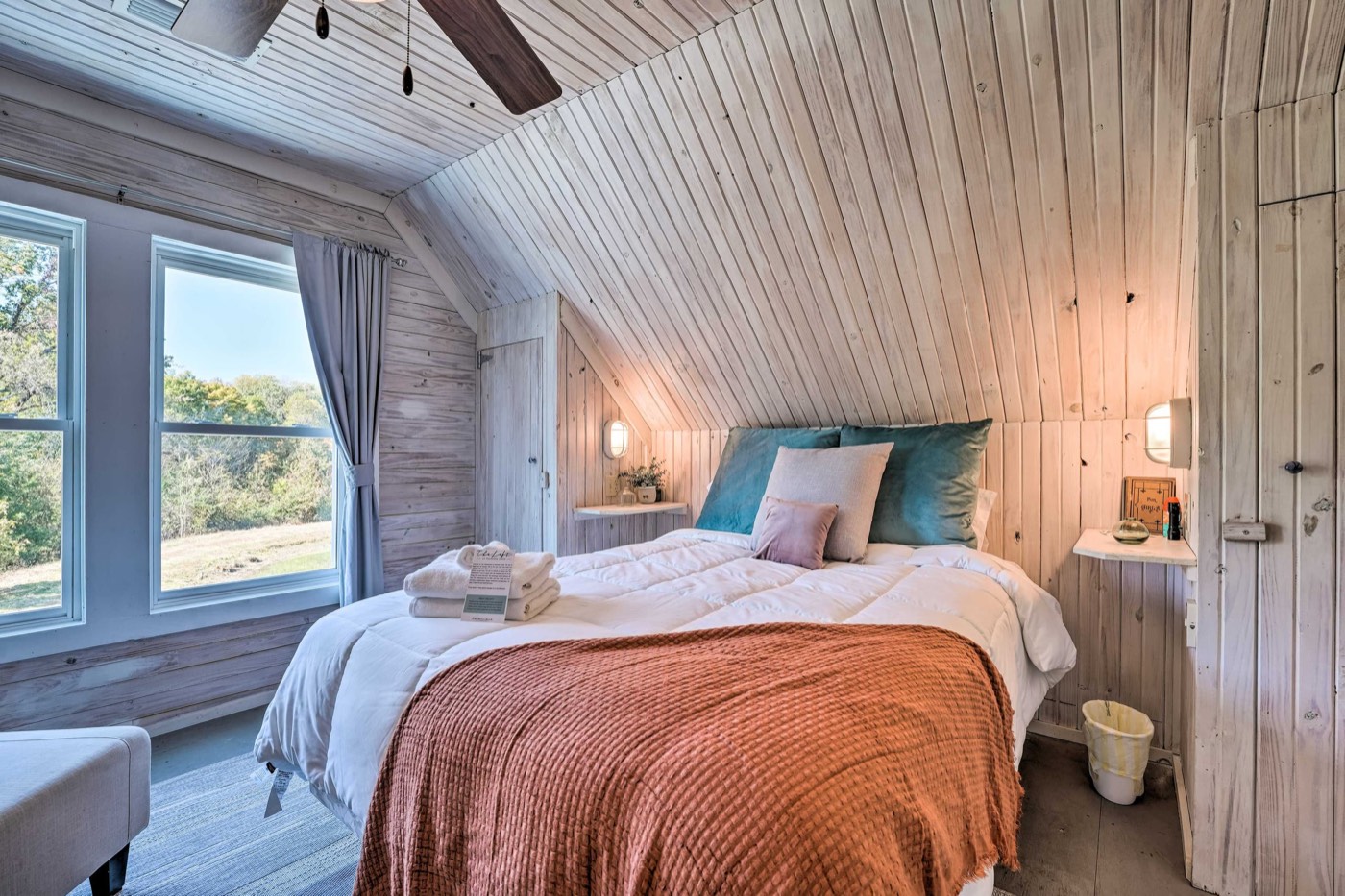 Second Loft bedroom with a queen bed under the eaves