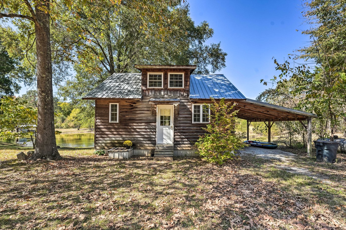Cabin with the pond behind it